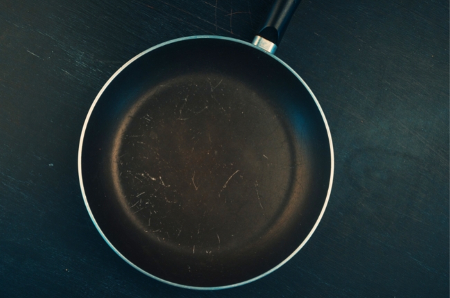 How do you keep an iron skillet from scratching an induction stove